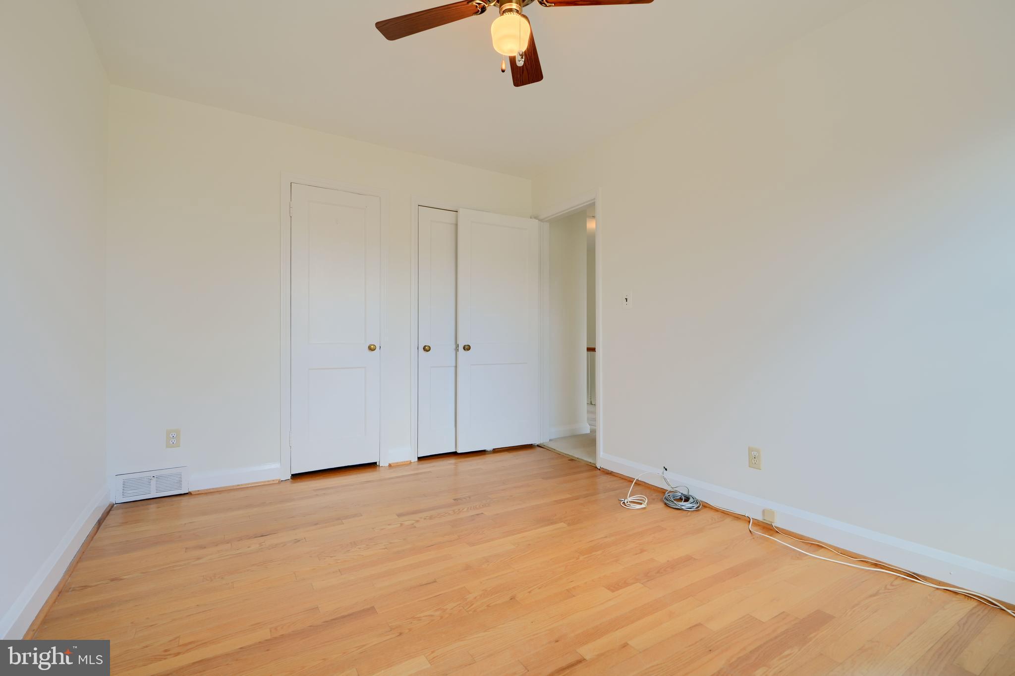 1852 Edgewood Road Towson, MD 21286 - Photo 20 of 31 a view of a room with a ceiling fan and hardwood floor