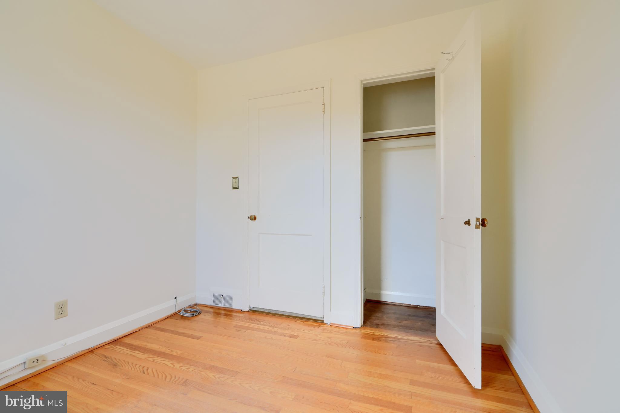 1852 Edgewood Road Towson, MD 21286 - Photo 21 of 31 a view of an empty room with wooden floor and closet