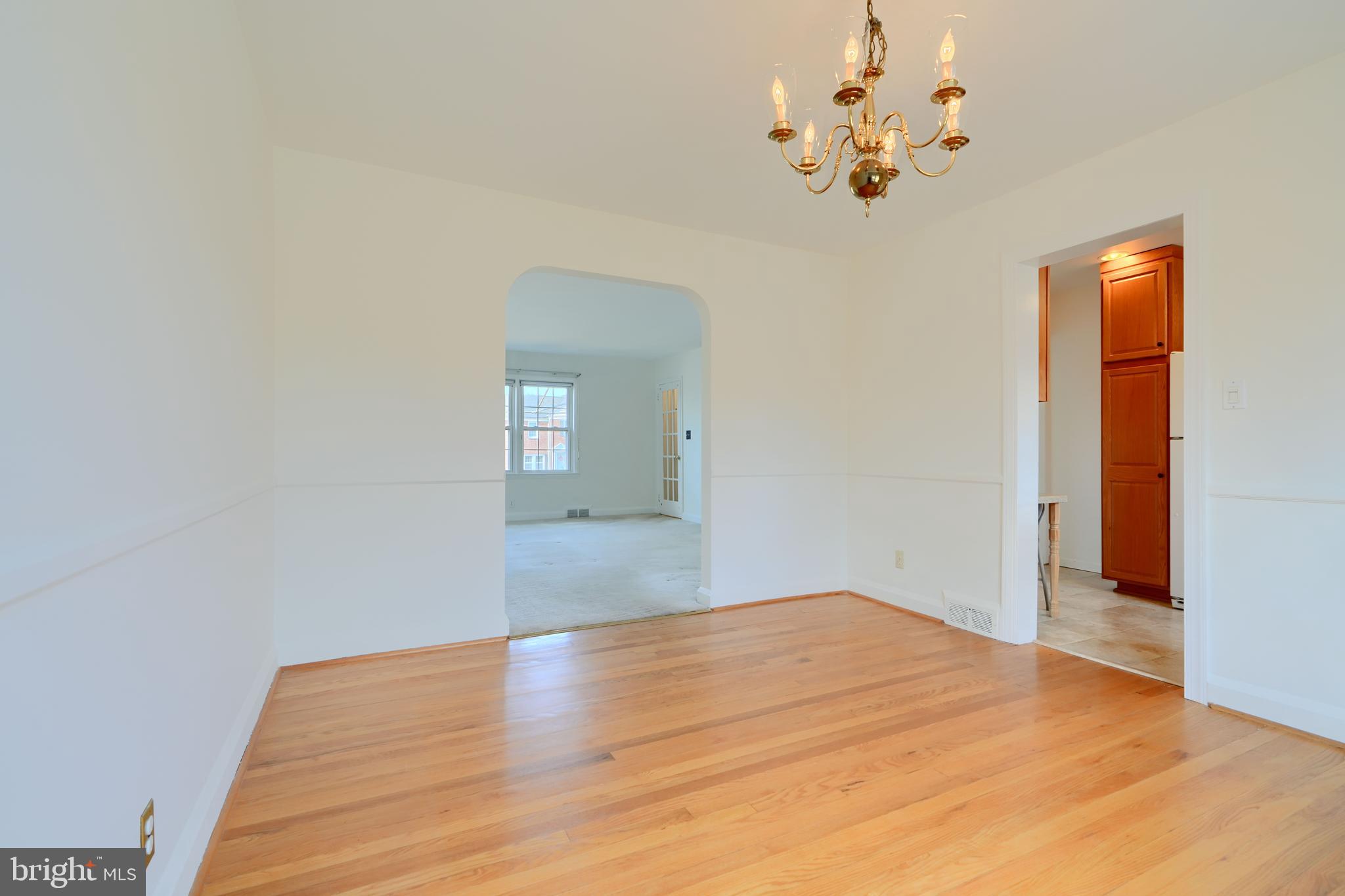 1852 Edgewood Road Towson, MD 21286 - Photo 8 of 31 a view of empty room with wooden floor