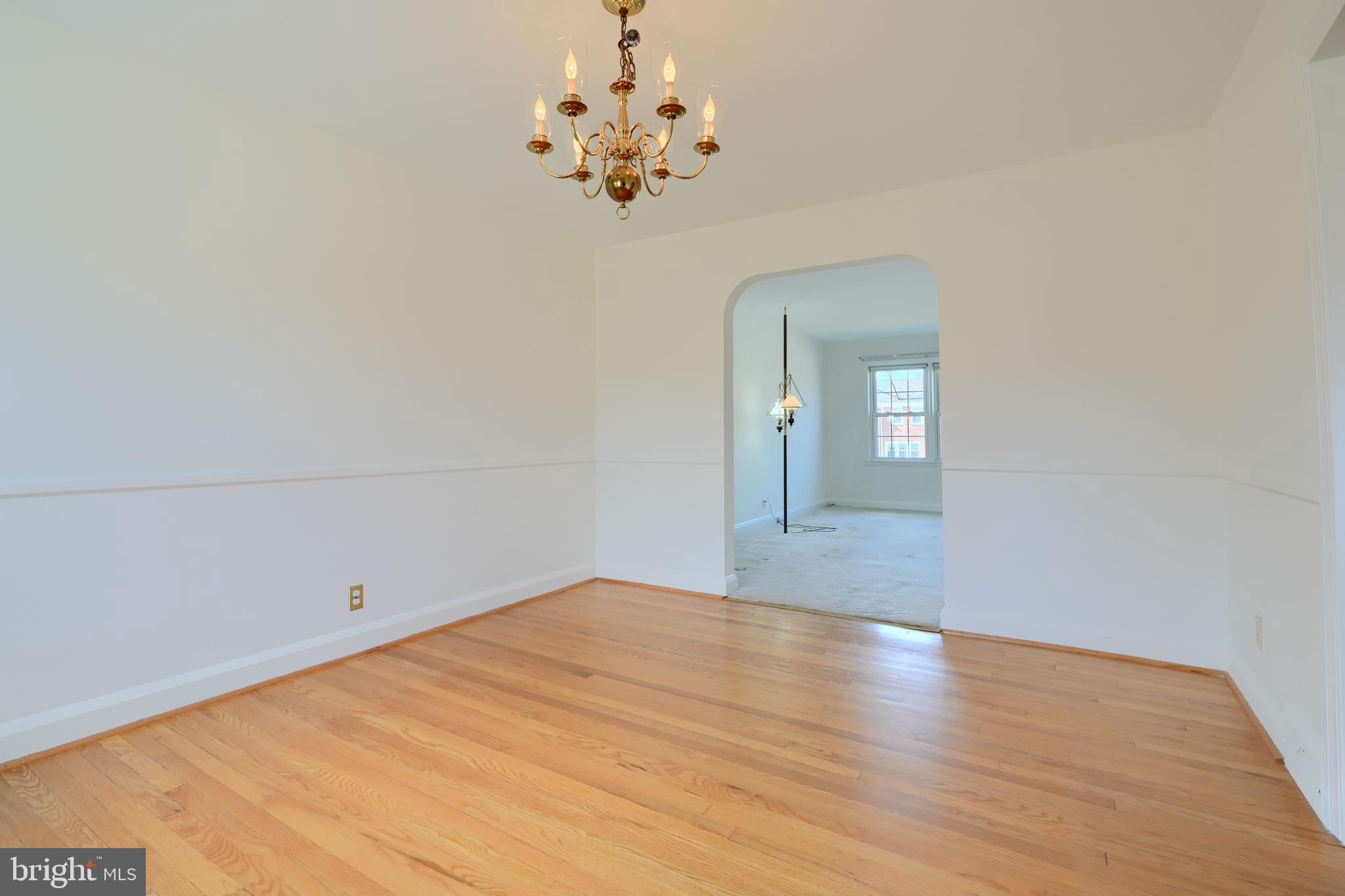 1852 Edgewood Road Towson, MD 21286 - Photo 9 of 31 a view of a room with wooden floor and chandelier