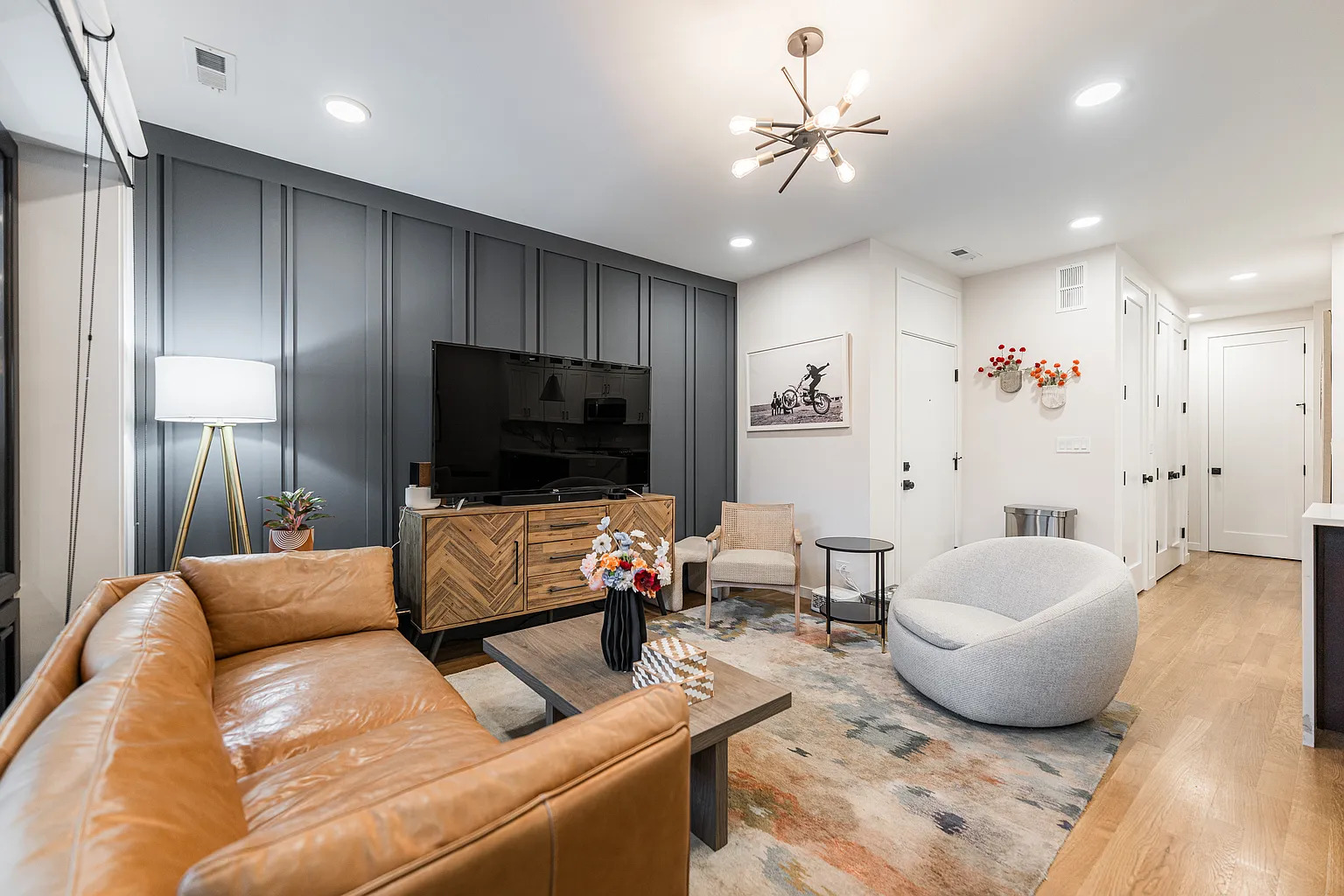 1703 West Chicago Avenue, Unit 4 Chicago, IL 60622 - Photo 2 of 11 a living room with furniture and a flat screen tv