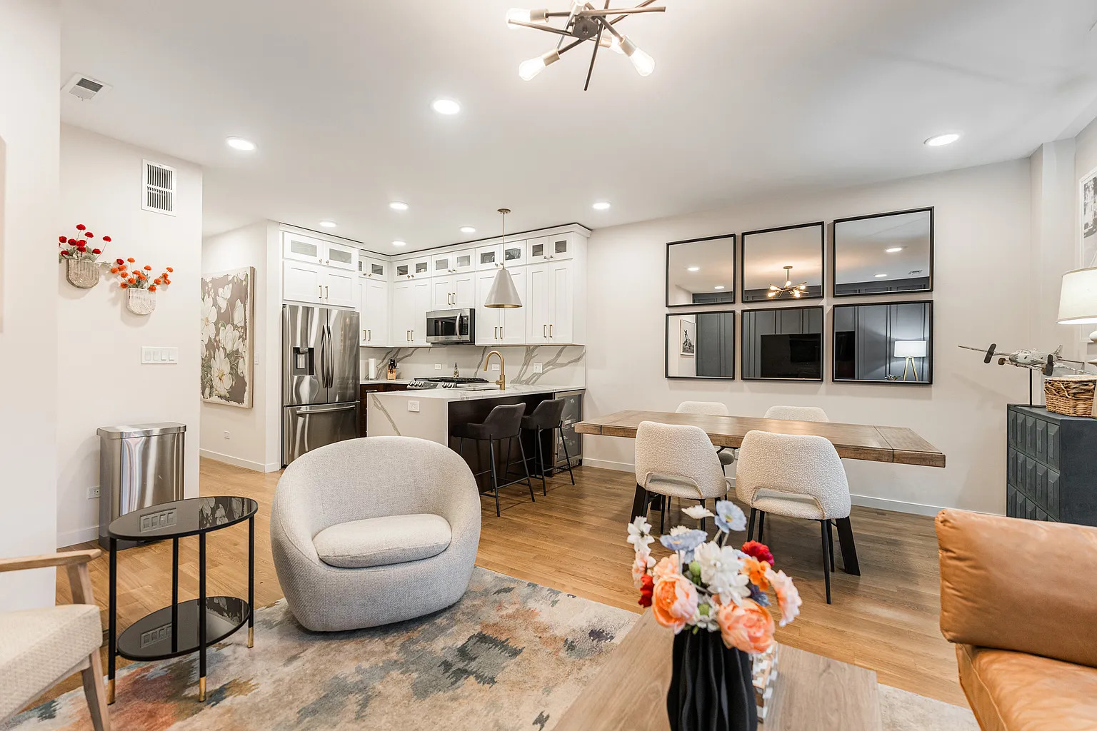 1703 West Chicago Avenue, Unit 4 Chicago, IL 60622 - Photo 3 of 11 a living room with stainless steel appliances furniture and a kitchen view