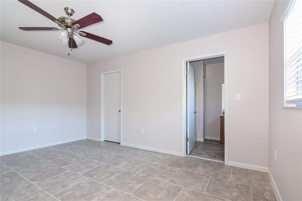 3610 West Leila Avenue Tampa, FL 33611 - Photo 8 of 15 a view of a livingroom with a ceiling fan and window