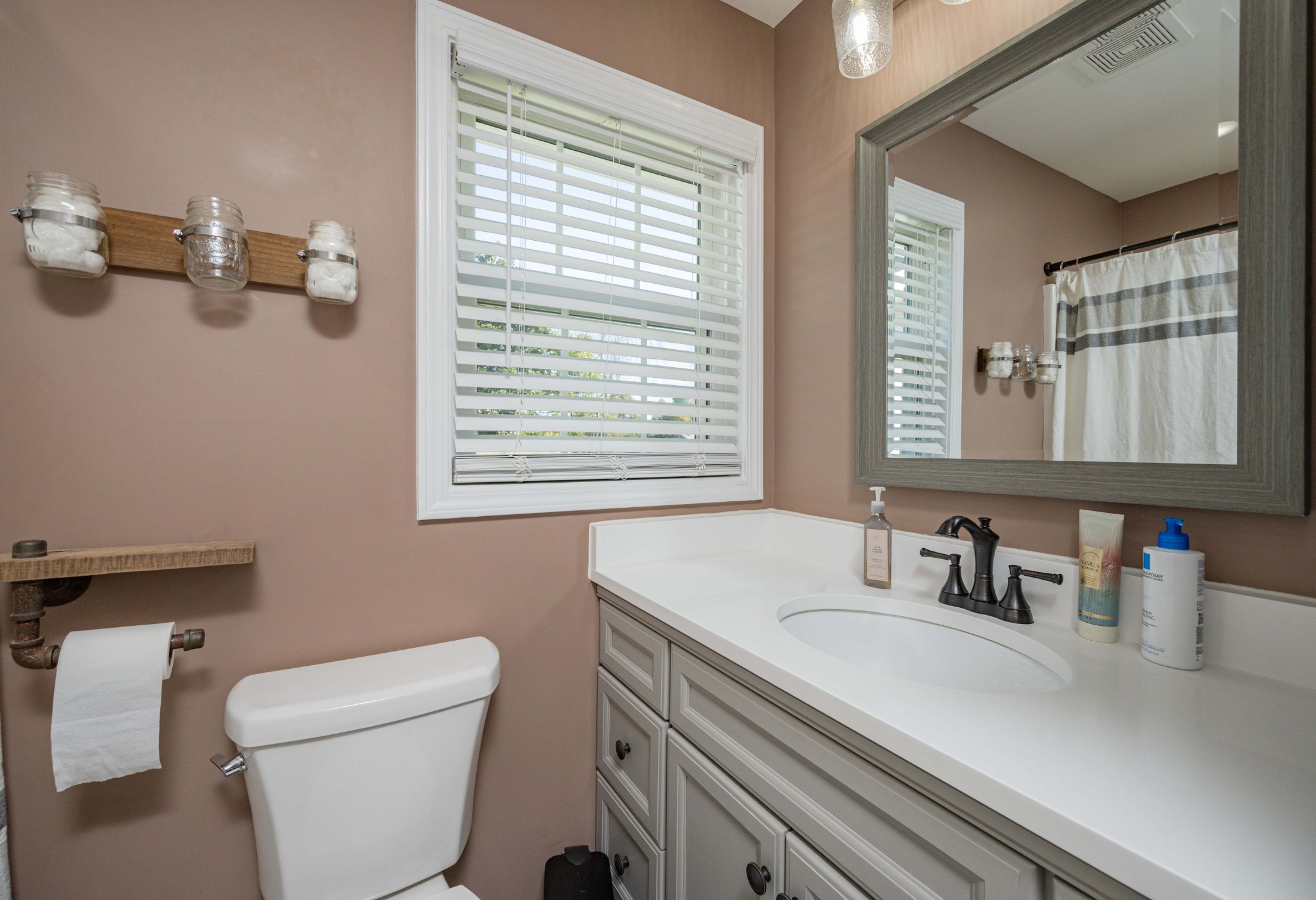 49 Bush Road Bradyville, TN 37026 - Photo 22 of 38 a bathroom with a sink a toilet and a window