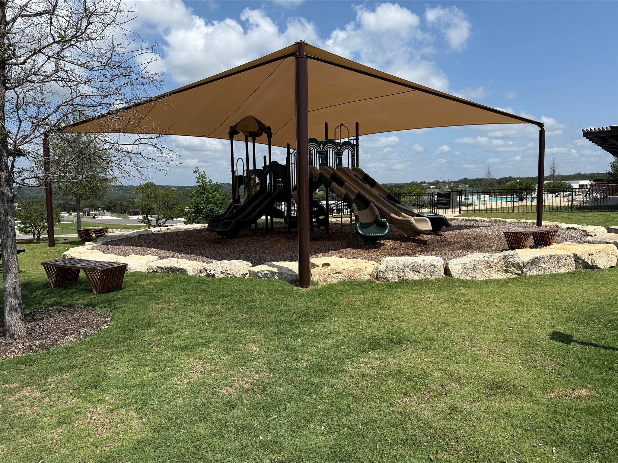 5386 Ranch Road 1376, Unit 210 Fredericksburg, TX 78624 - Photo 11 of 13 a view of a garden with a patio