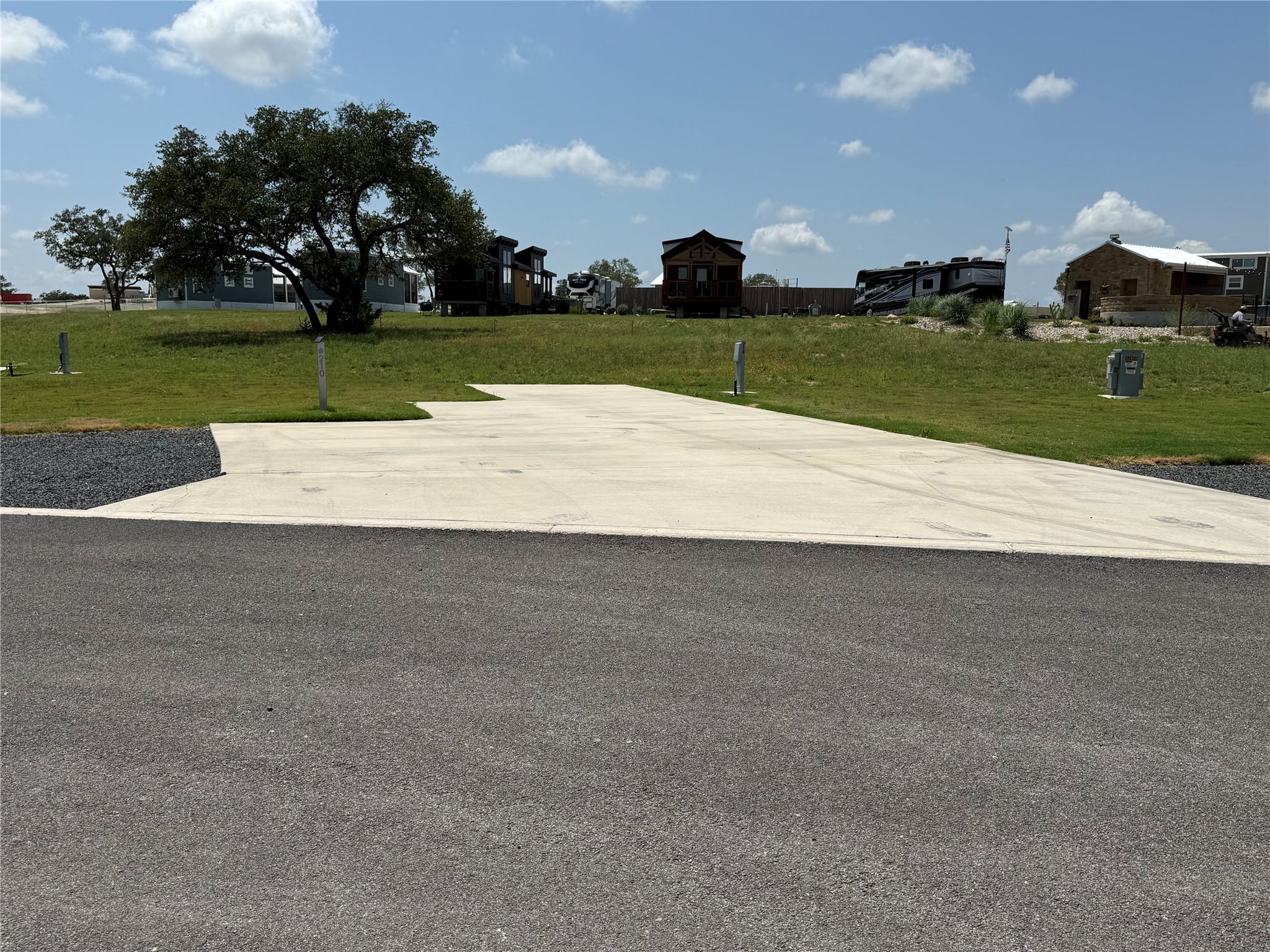5386 Ranch Road 1376, Unit 210 Fredericksburg, TX 78624 - Photo 2 of 13 a view of a golf course with a lake