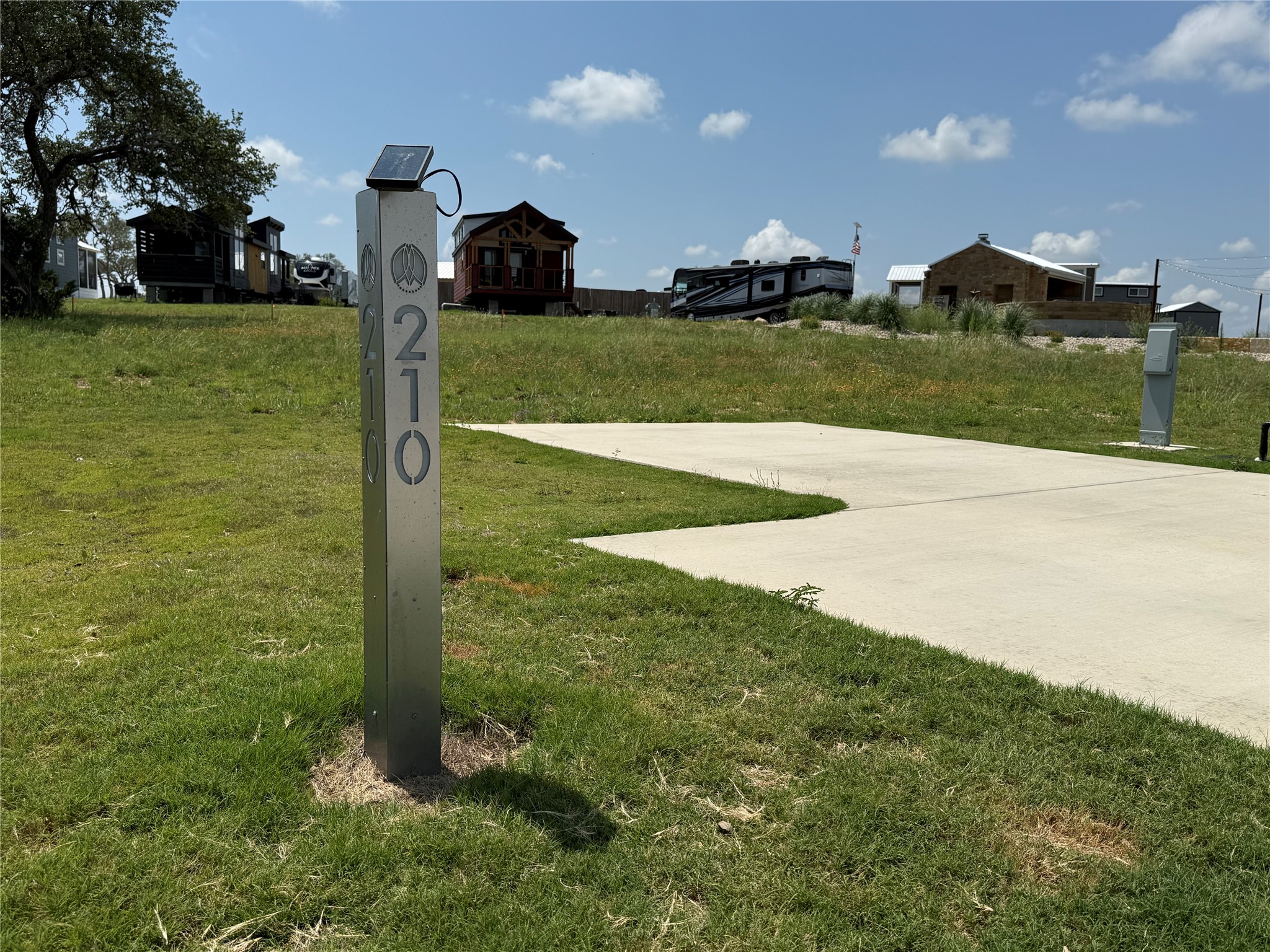 5386 Ranch Road 1376, Unit 210 Fredericksburg, TX 78624 - Photo 3 of 13 a view of a golf course with a house