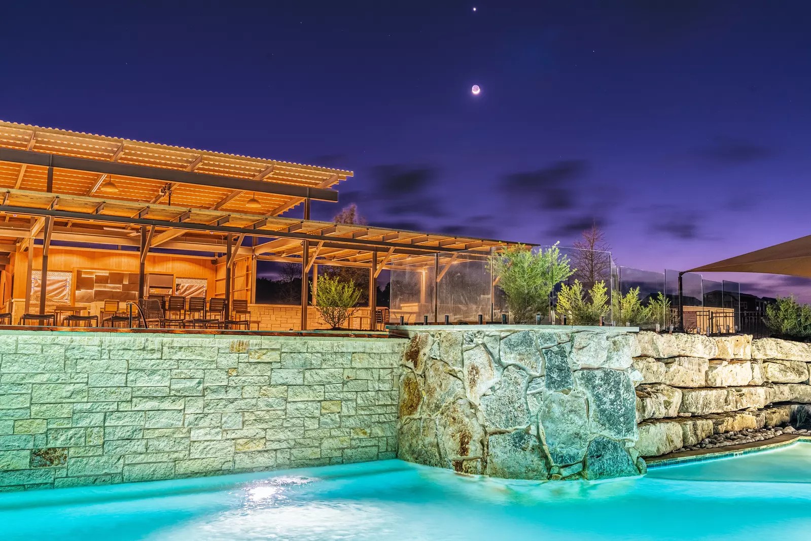 5386 Ranch Road 1376, Unit 210 Fredericksburg, TX 78624 - Photo 6 of 13 a view of a pathway along the building