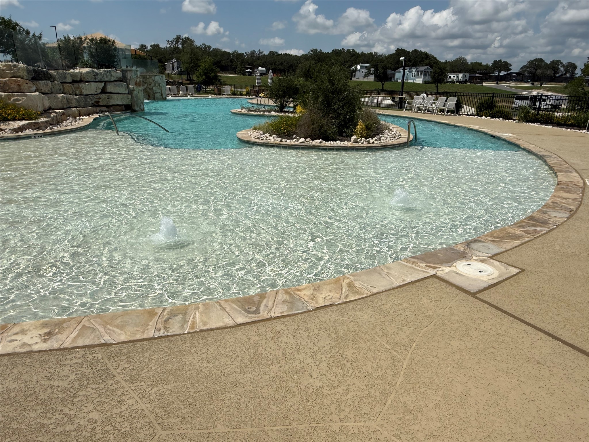 5386 Ranch Road 1376, Unit 210 Fredericksburg, TX 78624 - Photo 7 of 13 a view of a swimming pool and outdoor space
