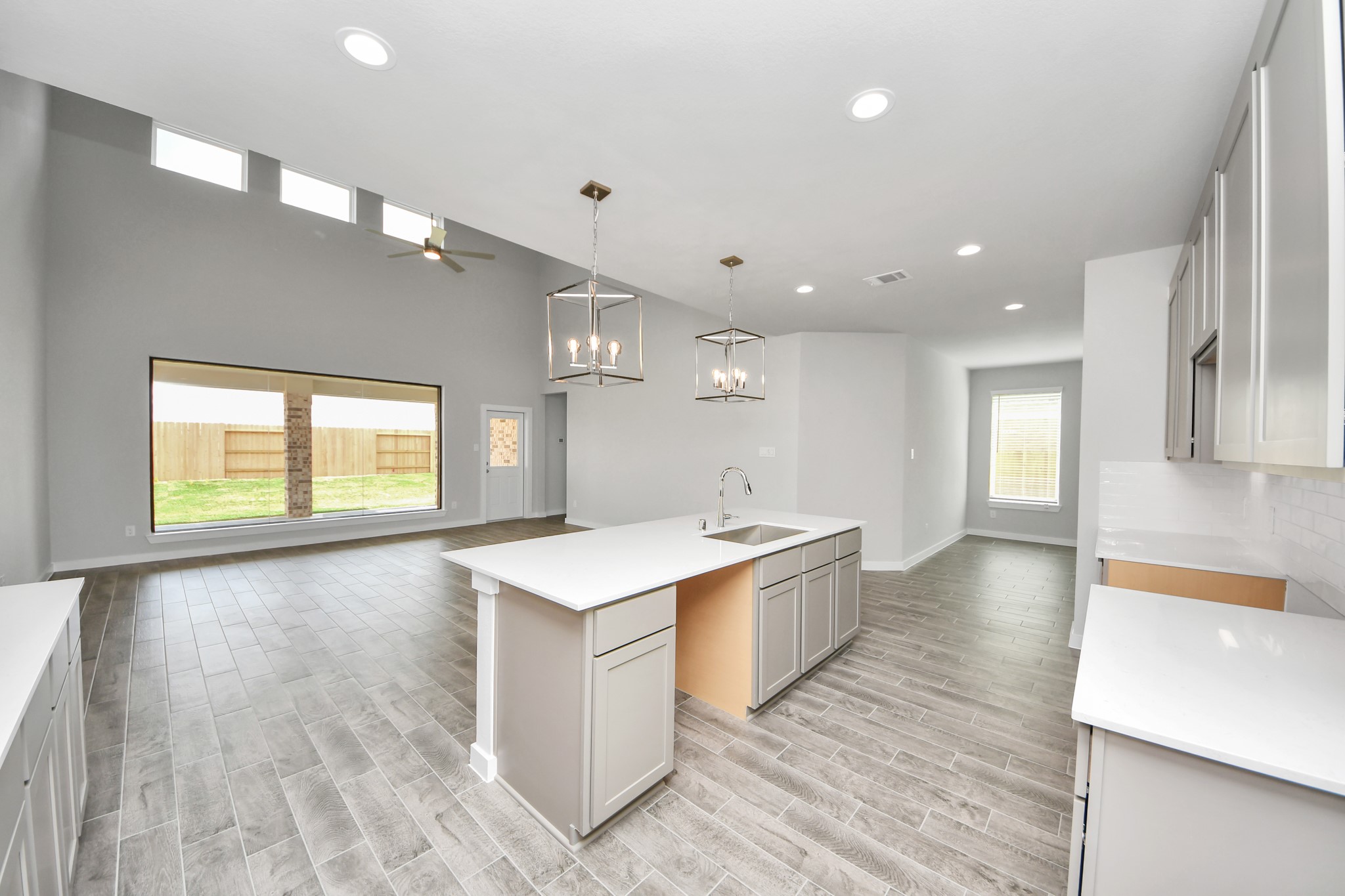 11106 Tulip Rdg Trail Houston, TX 77044 - Photo 13 of 34 All of this overlooks your expansive family room, creating a perfect space for culinary delights and family gatherings. Sample photo of completed home with similar floor plan. Actual colors and selections may vary.