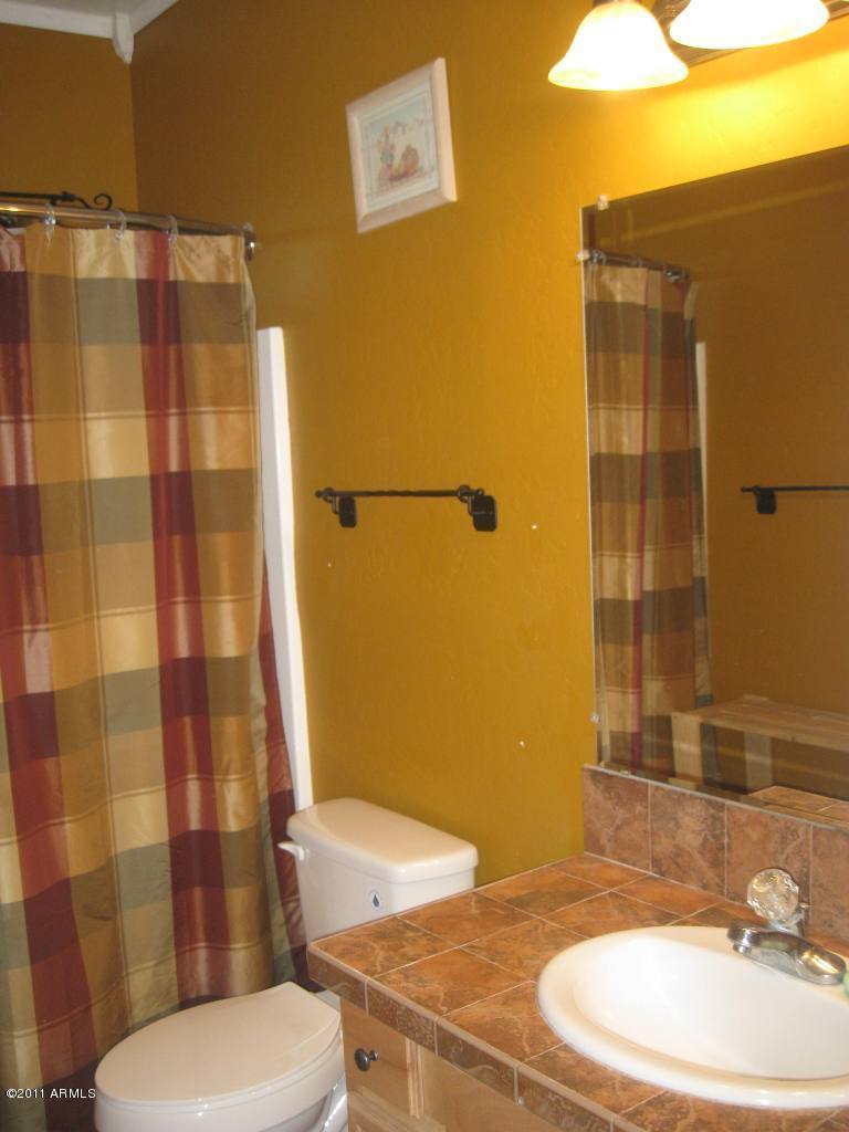 3130 South Olmo Road Maricopa, AZ 85139 - Photo 23 of 34 Hall Bath Tile Counters