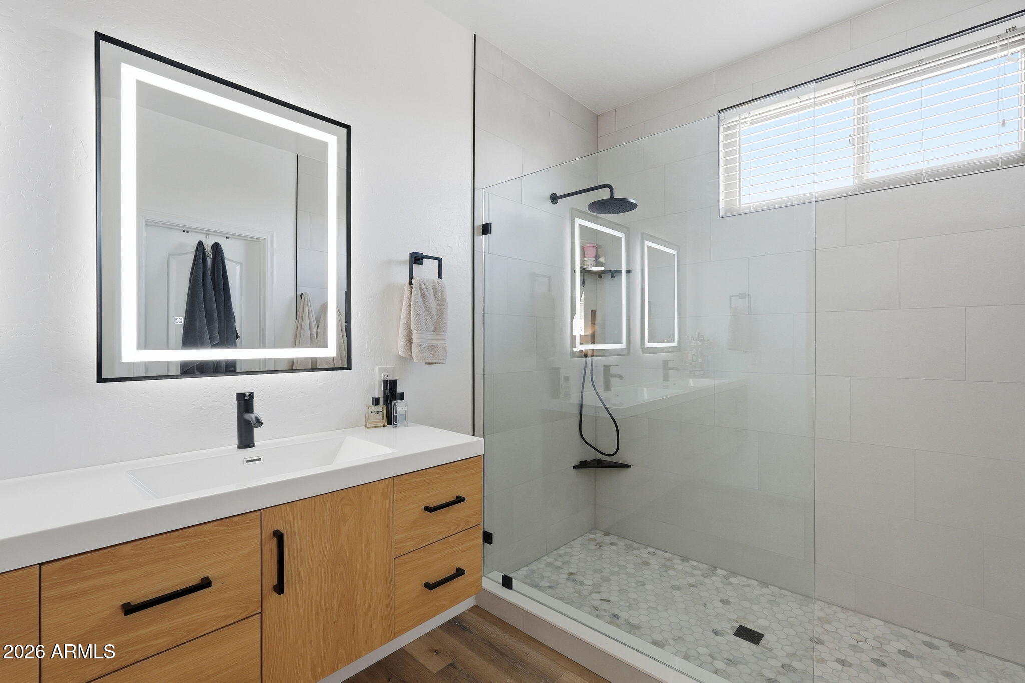 4184 East Trigger Way Gilbert, AZ 85297 - Photo 6 of 51 a bathroom with a sink a mirror and shower