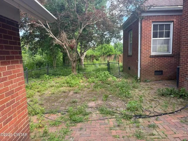 a backyard of a house with lots of green space