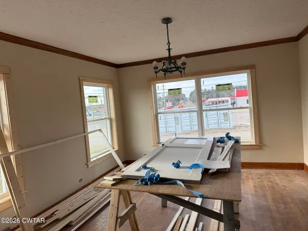 a workspace with furniture and window