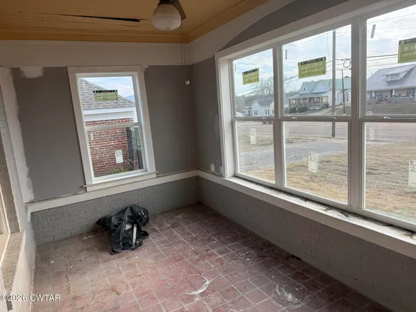 a view of an empty room and window