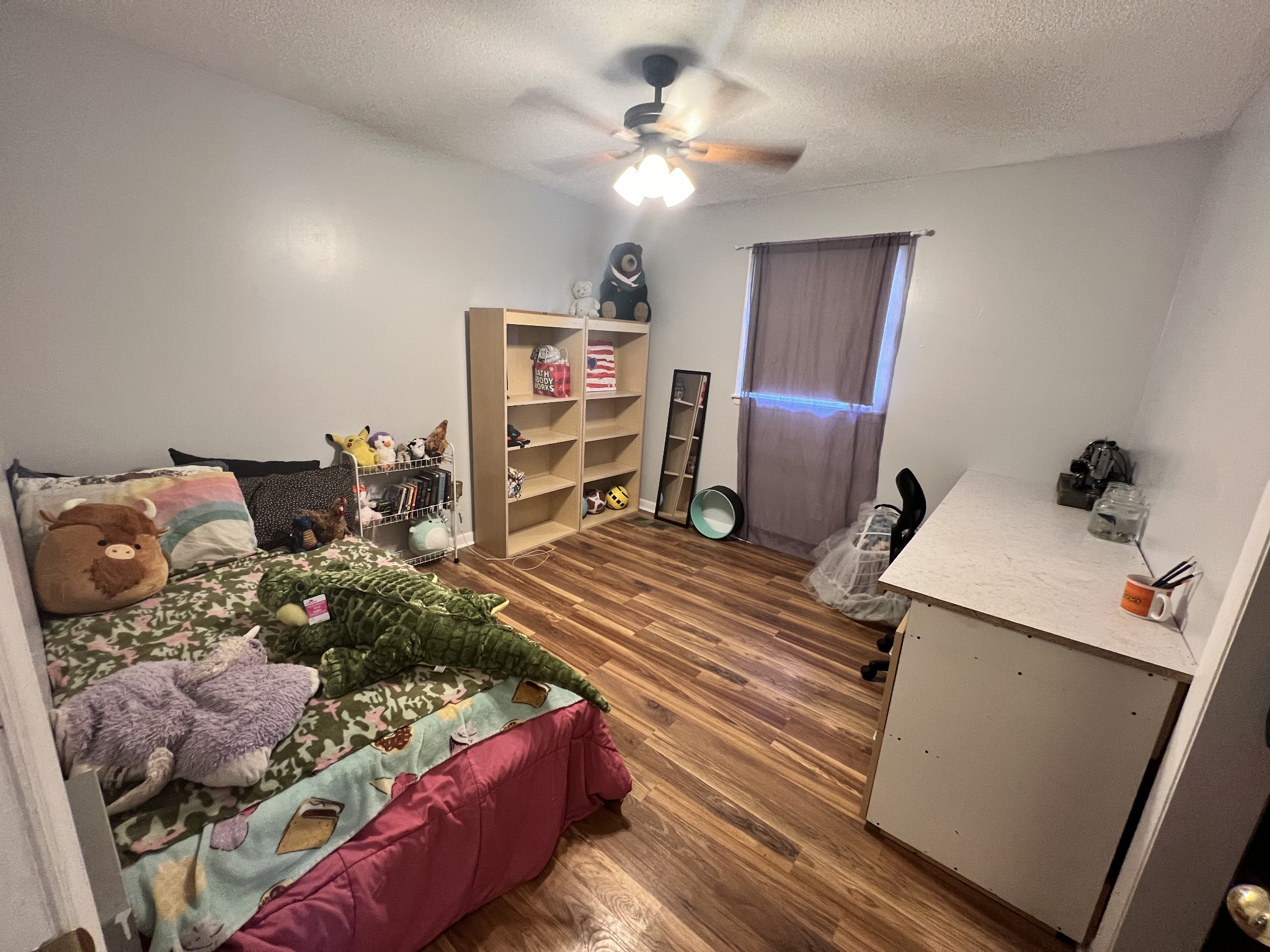 132 Pratt Road Manchester, TN 37355 - Photo 14 of 50 a bedroom with a bed and wooden floor