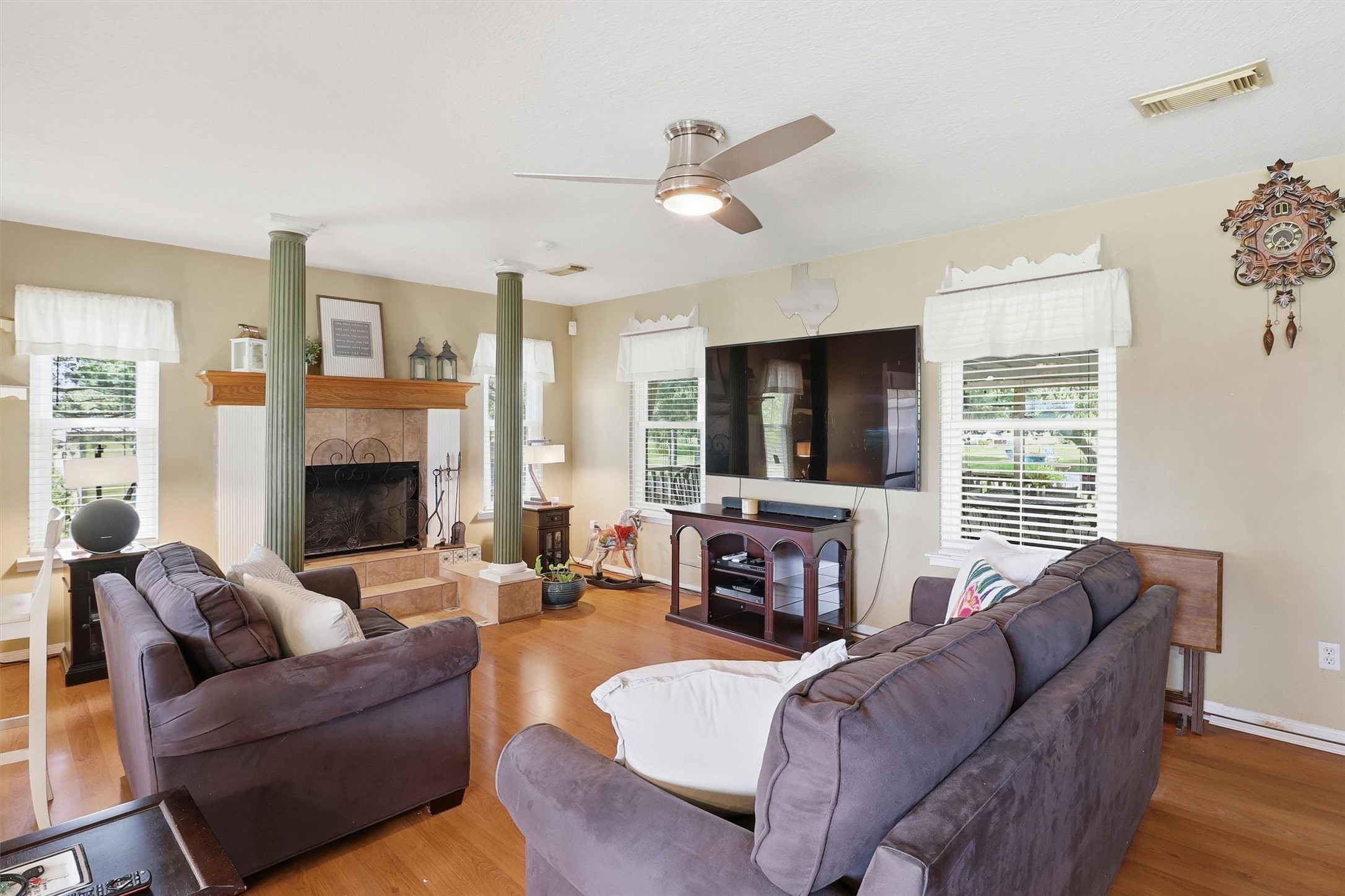 2325 Skrivanek Road Sealy, TX 77474 - Photo 18 of 36 a living room with furniture a fireplace and a flat screen tv