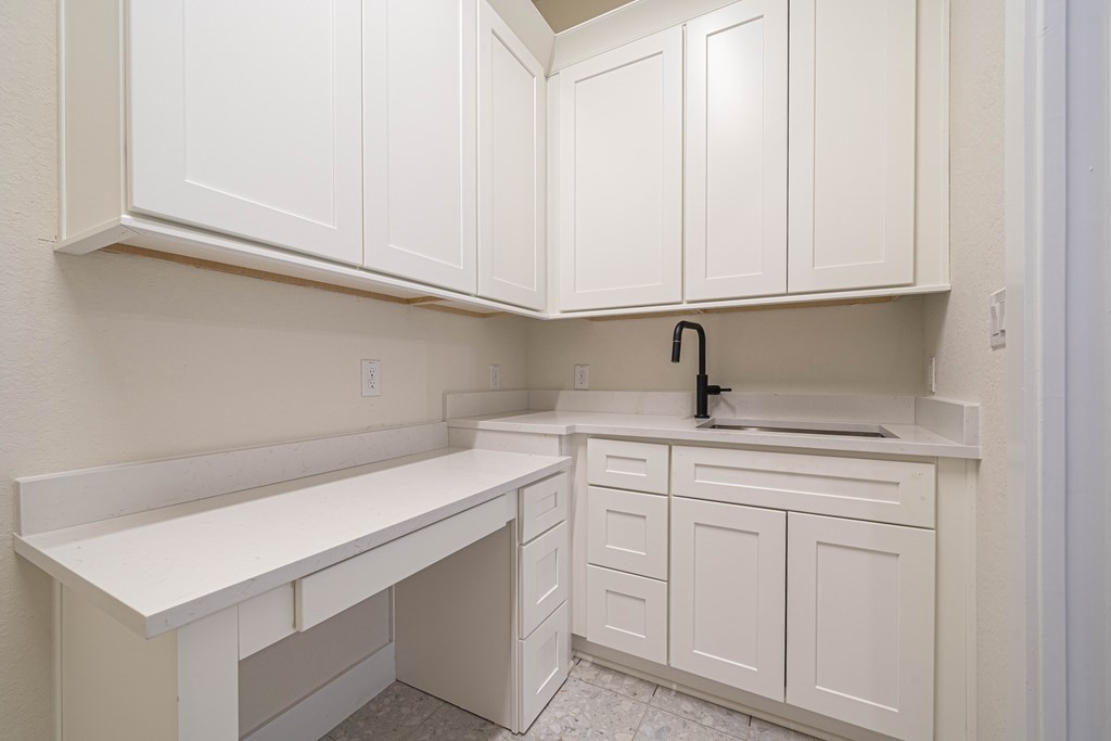 2013 Toscano Way Kerrville, TX 78028 - Photo 14 of 17 a kitchen with white cabinets
