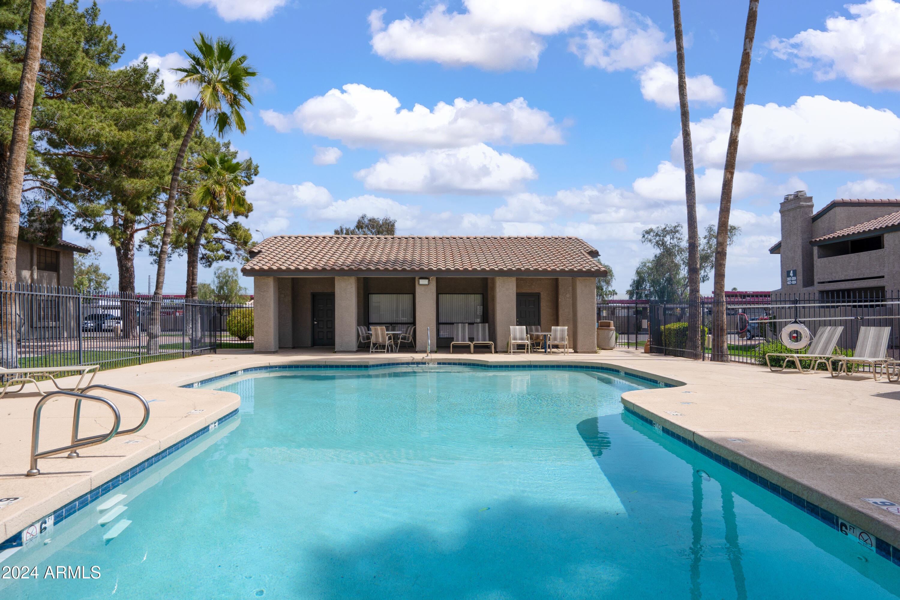 533 West Guadalupe Road, Unit 1063 Mesa, AZ 85210 - Photo 55 of 57 a swimming pool with outdoor seating and yard
