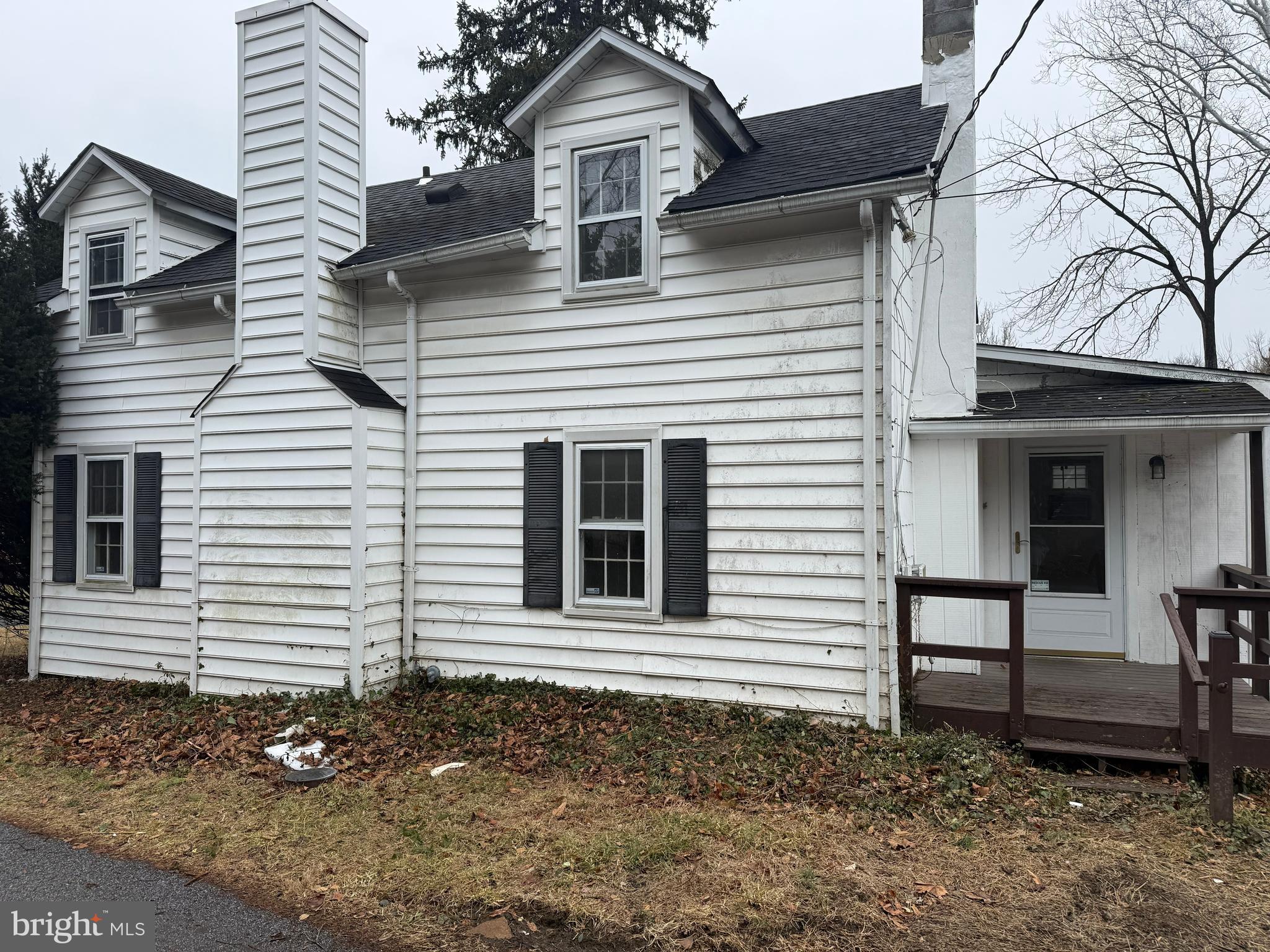 a view of a house with a yard and chair