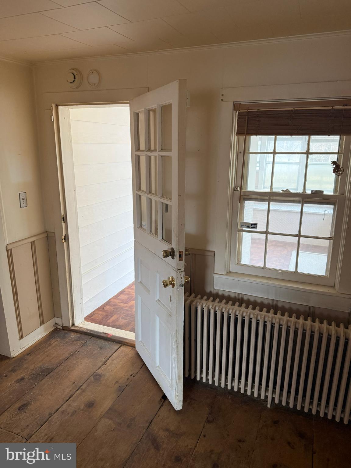 8026 Rider Avenue Towson, MD 21204 - Photo 12 of 29 an empty room with wooden floor and windows