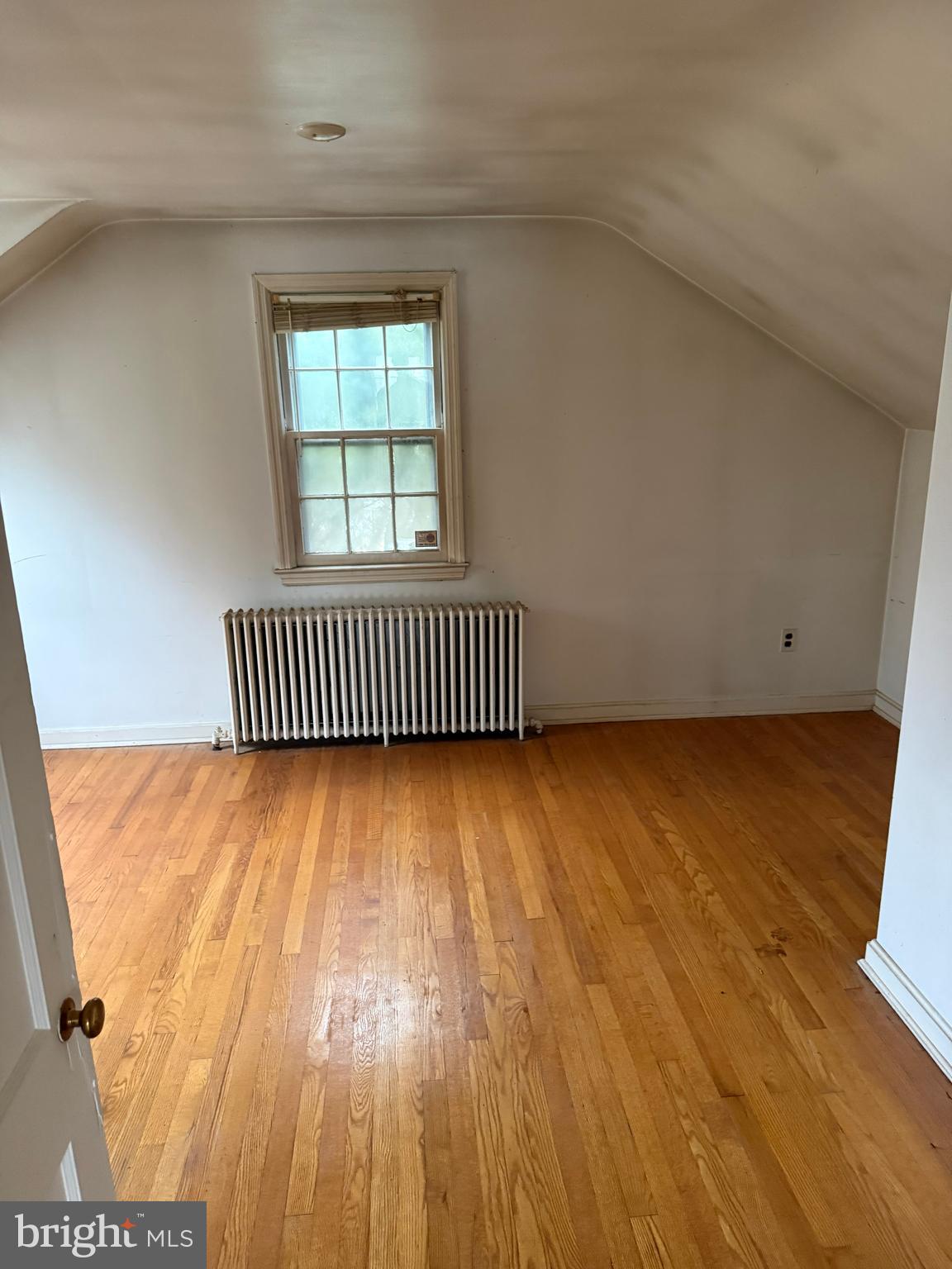 8026 Rider Avenue Towson, MD 21204 - Photo 20 of 29 an empty room with wooden floor and windows