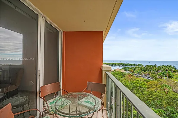 a view of a balcony with an ocean view