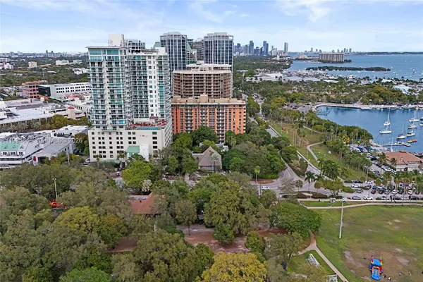 an aerial view of a city with lawn chairs