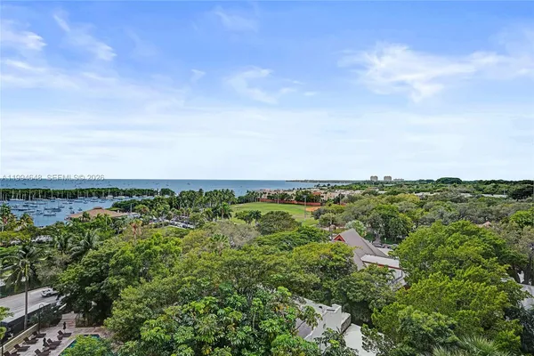 a kitchen with a refrigerator and a sink