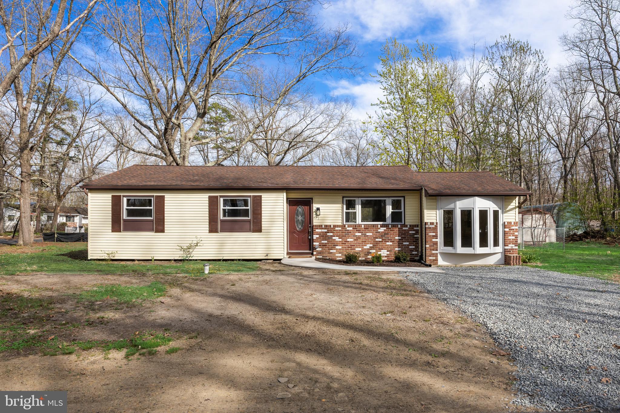 601 New York Road Browns Mills, NJ 08015 - Photo 1 of 27 a front view of a house with a yard