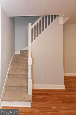 a view of an entryway with wooden floor