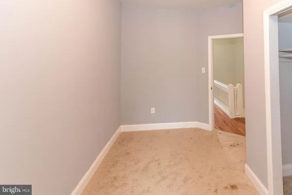 a bathroom with a sink toilet and a mirror