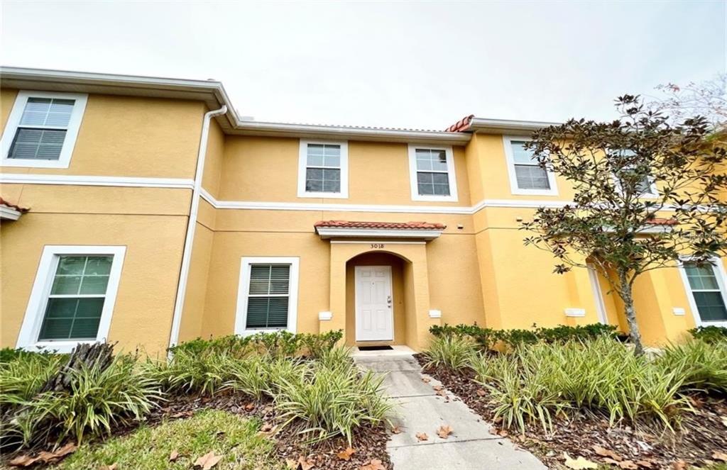 3018 Red Ginger Road Kissimmee, FL 34747 - Photo 1 of 1 a front view of a house with garden