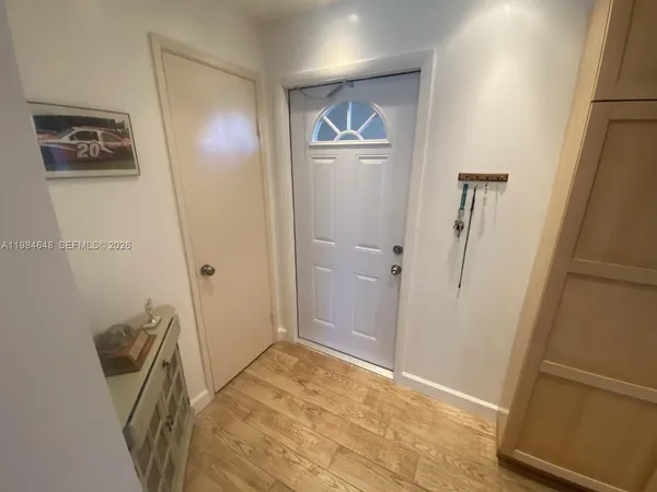 a bedroom with bed and a window