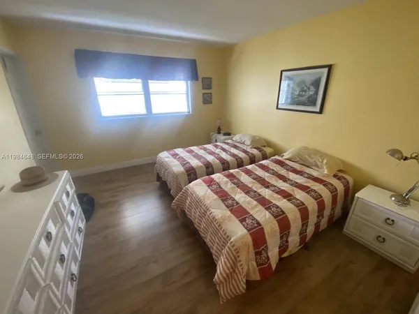 a view of a hallway with furniture and front door
