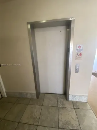 a kitchen with a refrigerator and a sink