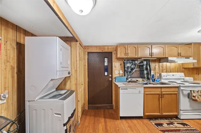 a kitchen with a stove and a refrigerator