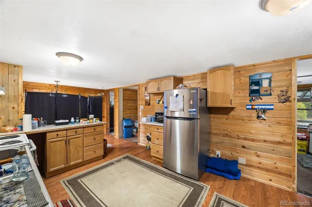 a kitchen with stainless steel appliances a stove and a refrigerator