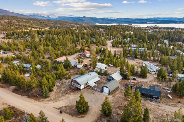 an aerial view of residential building with parking