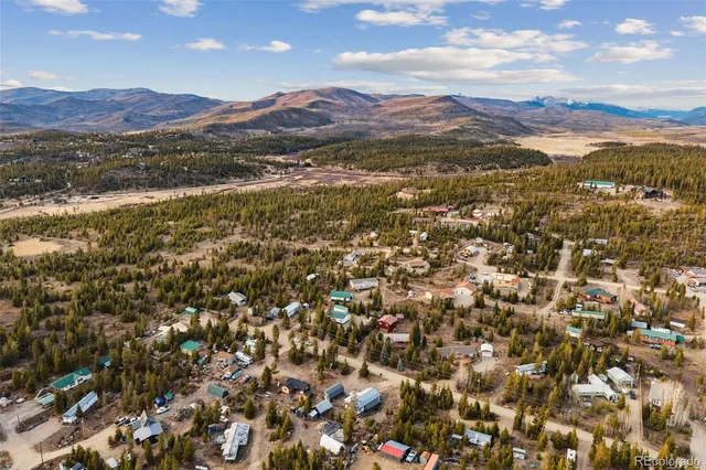 a view of a city with mountains in the background