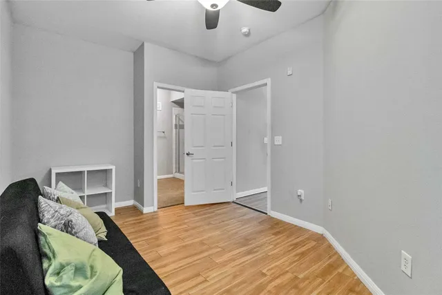 a bedroom with a bed and a chair