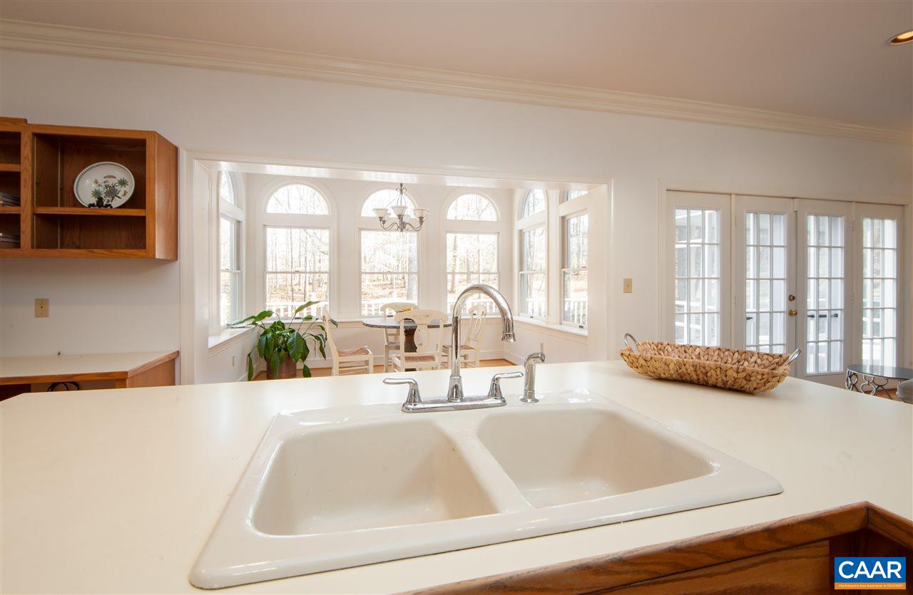 130 Terrell Road East Charlottesville, VA 22901 - Photo 14 of 44 a bathroom with a tub a double vanity and a large window