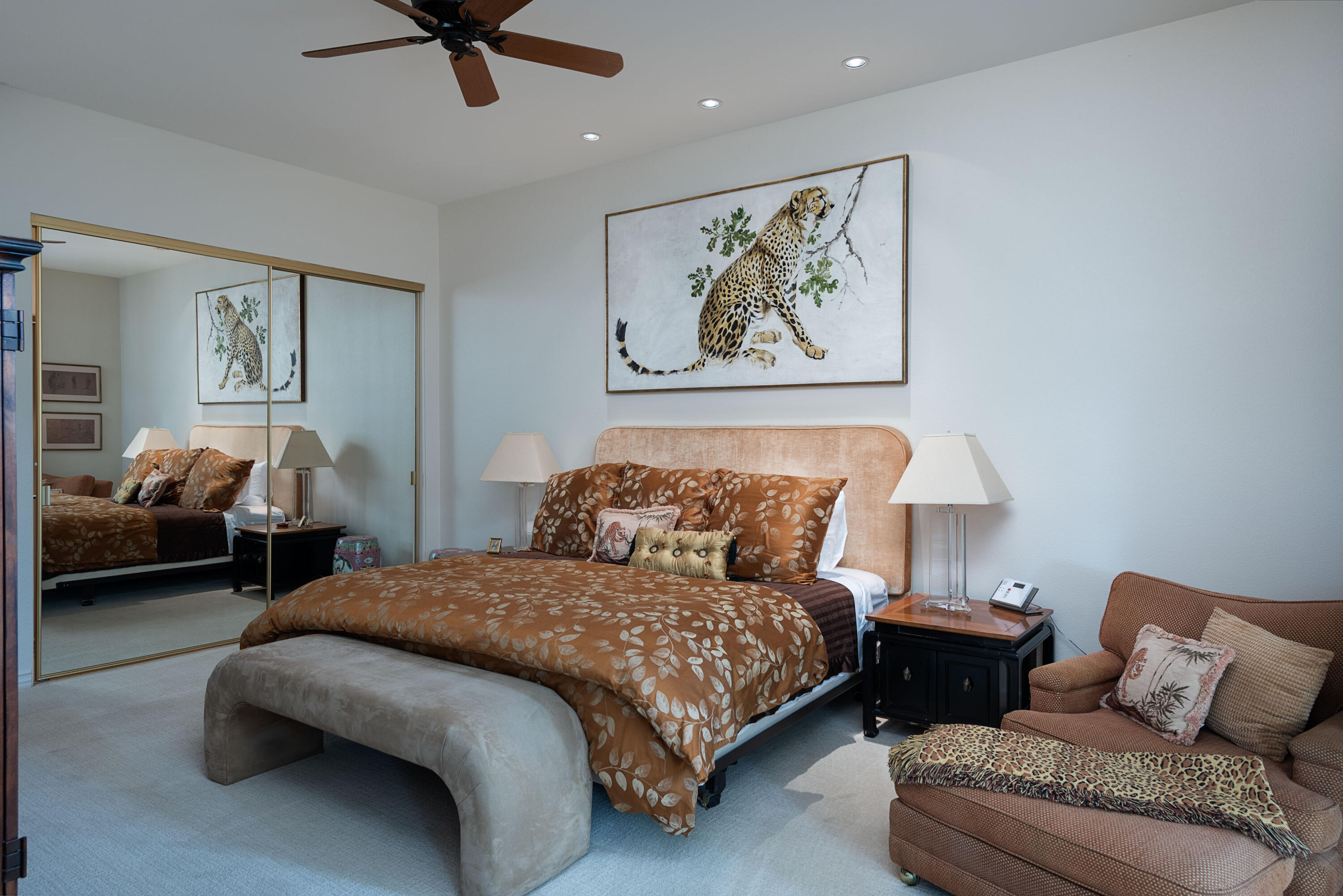 3 Cornell Drive Rancho Mirage, CA 92270 - Photo 23 of 46 a bedroom with a bed and glass walk in closet