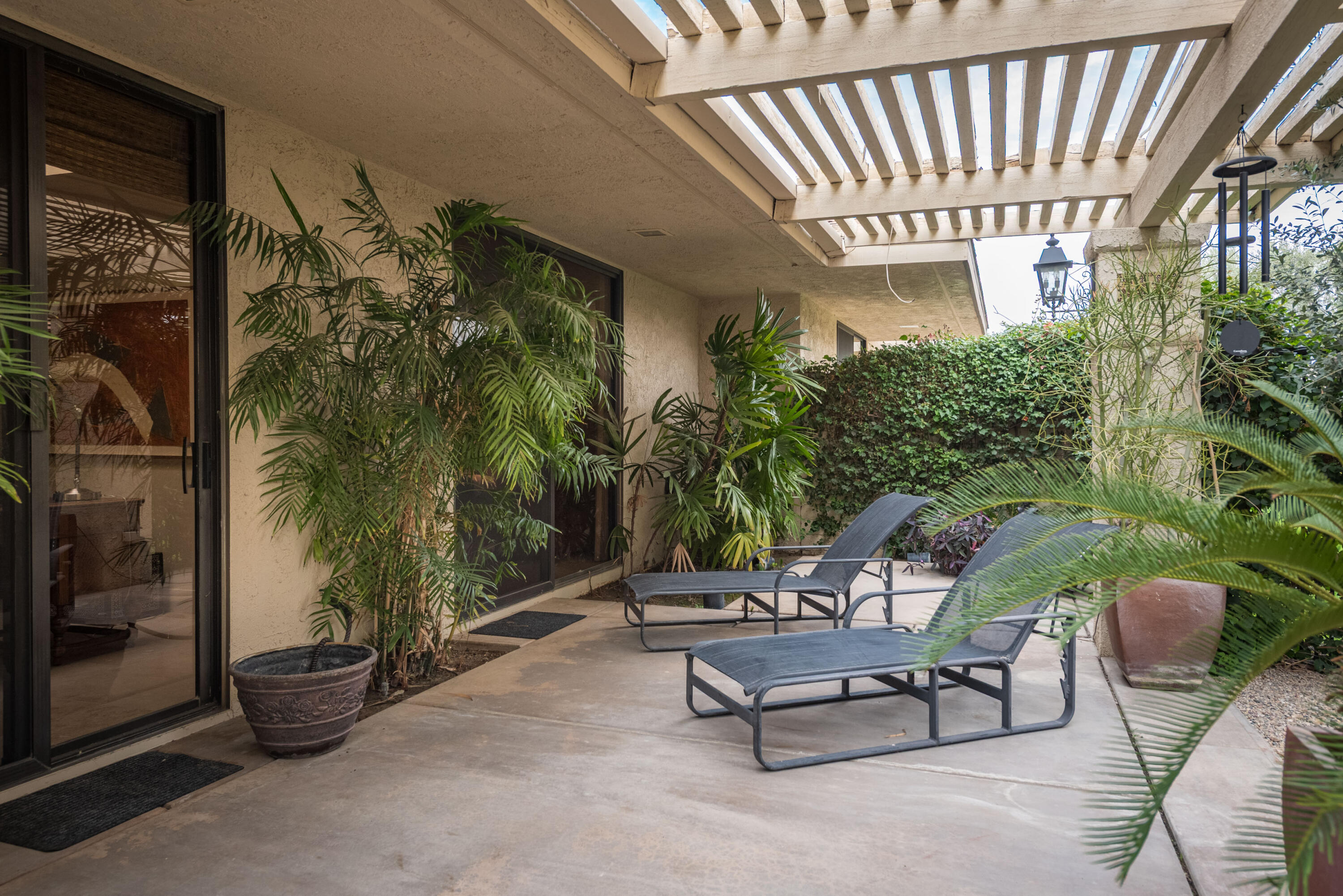 3 Cornell Drive Rancho Mirage, CA 92270 - Photo 45 of 46 a view of a patio with couple of chairs and a couch