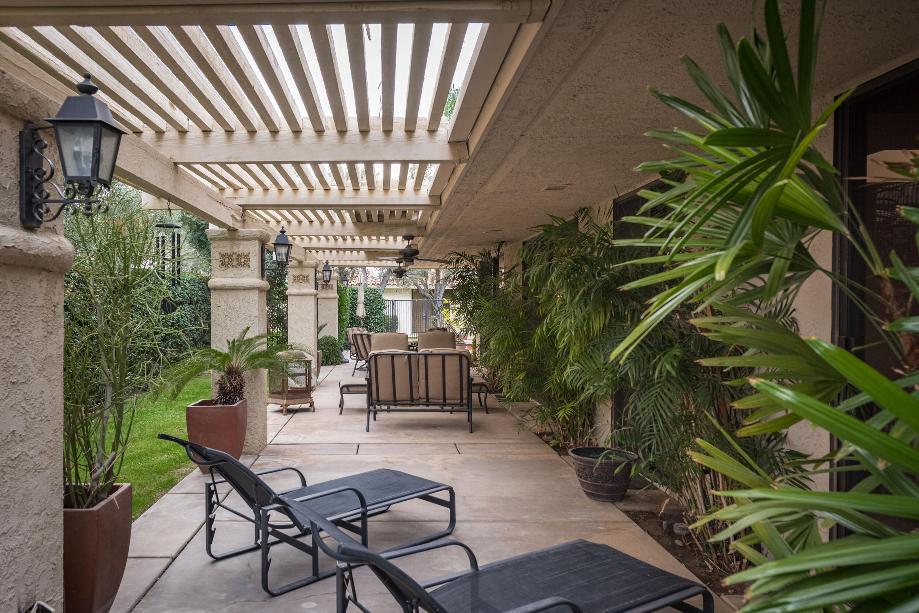 3 Cornell Drive Rancho Mirage, CA 92270 - Photo 46 of 46 a patio with glass top table and chairs