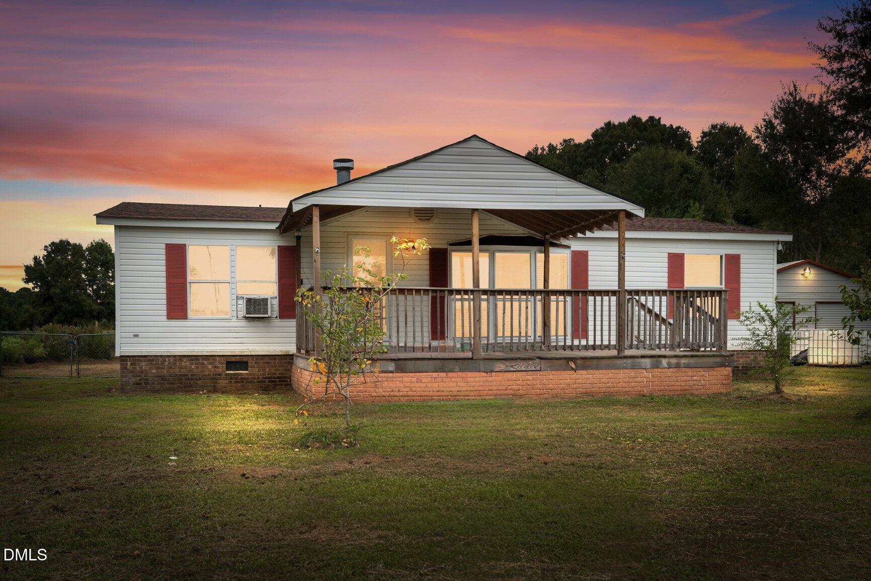 1835 Cokey Road Rocky Mount, NC 27801 - Photo 2 of 42 a front view of a house with a yard