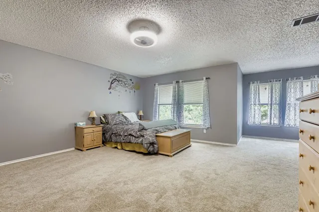 a bed room with furniture and a window