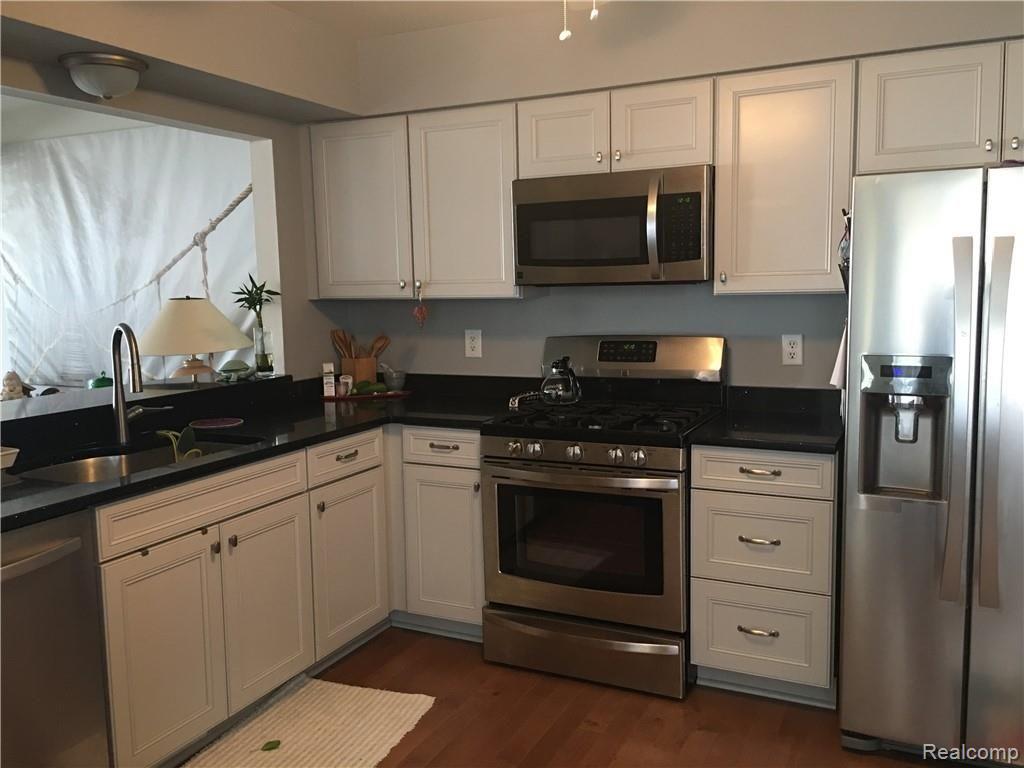 629 Summit Ridge Drive, Unit 13 Milford, MI 48381 - Photo 19 of 59 ALL NEW STAINLESS APPLIANCES AND GRANITE COUNTERS