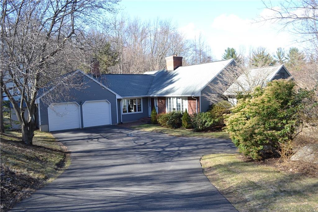 22 Westmont Road Avon, CT 06001 - Photo 1 of 1 a view of a house with a yard covered with snow