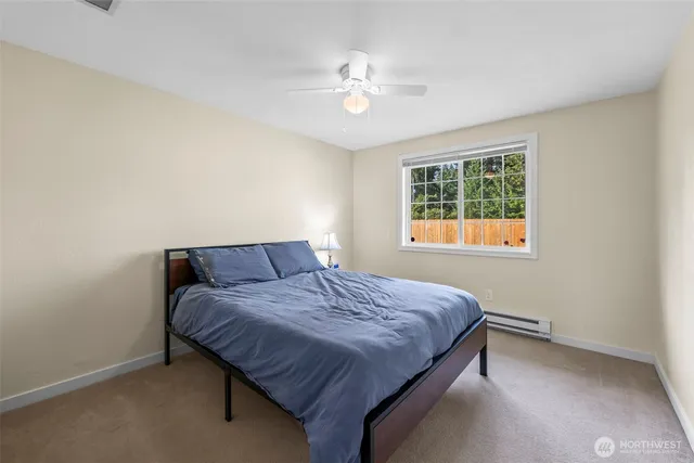 a bedroom with a bed and window